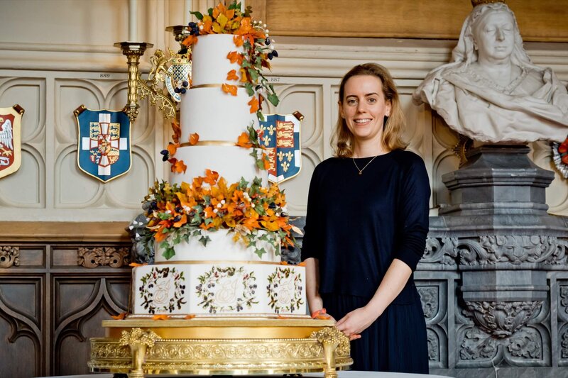 Sophie Cabot next to the Royal wedding cake