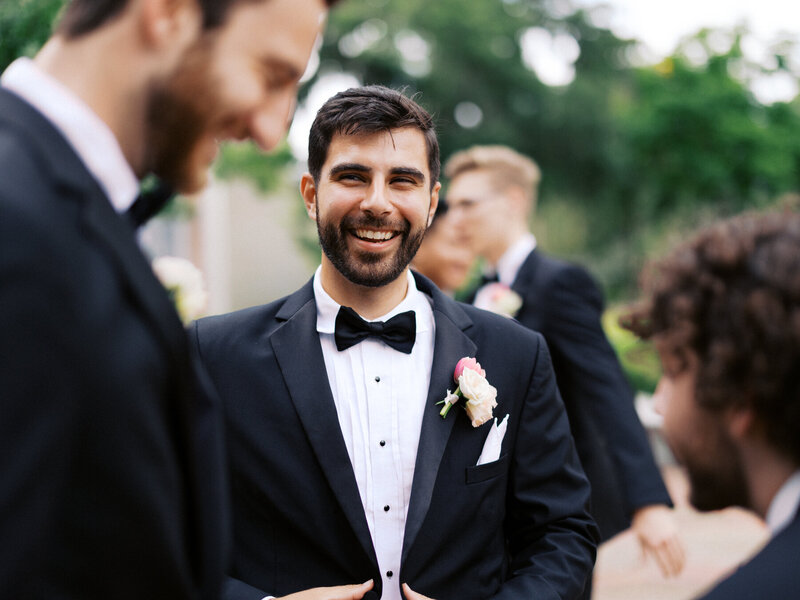 Guests laughing together during a reception toast at a St. Augustine wedding by Florida wedding photographer Jake Ford.
