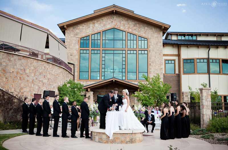 Outdoor-Ceremony-on-a-hot-sunny-day-at-Heritage-Eagle-Bend-in-Aurora-Colorado