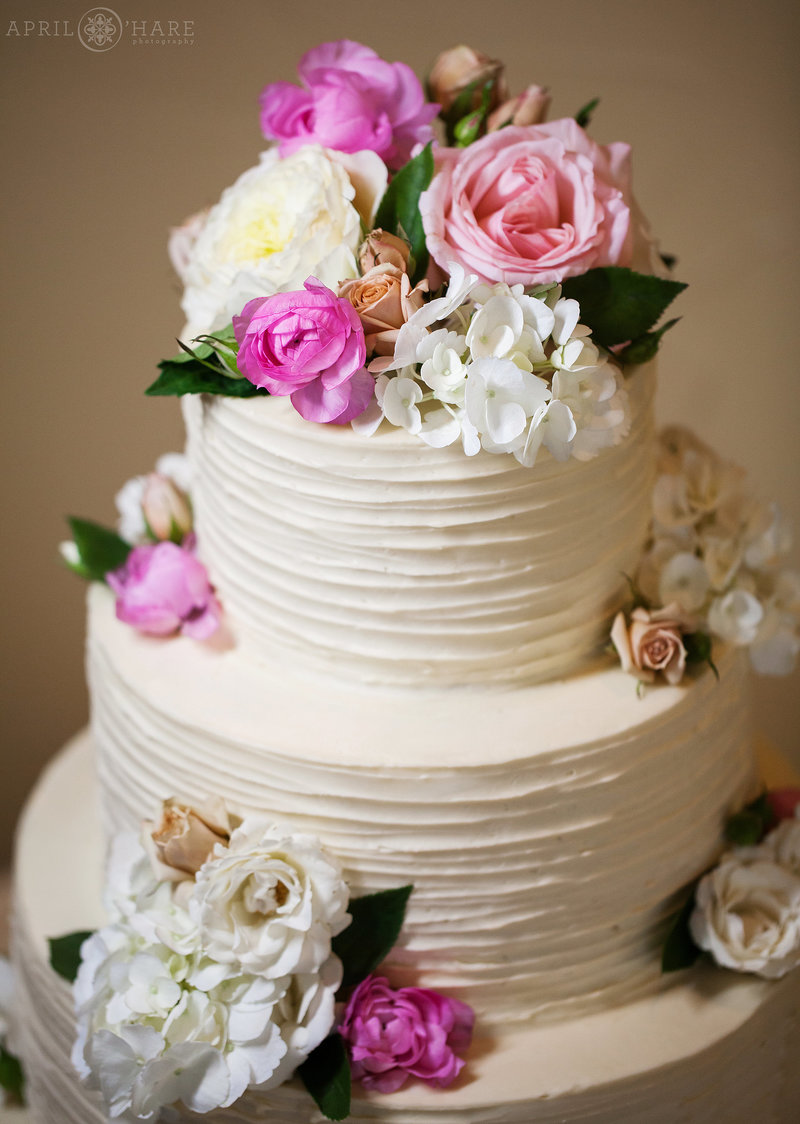 Four-Tier-White-Wedding-Cake-with-Florals-by-Blue-Moon-Bakery-in-Dillon-Colorado-2