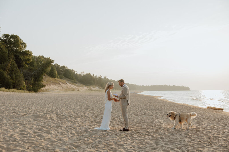 bride and groom saying vows on a beach in door county wisconsin