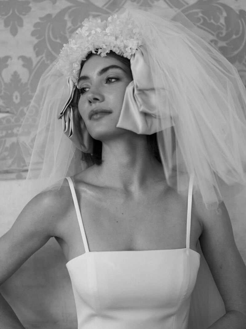 black and white portrait of bride wearing headpiece and veil
