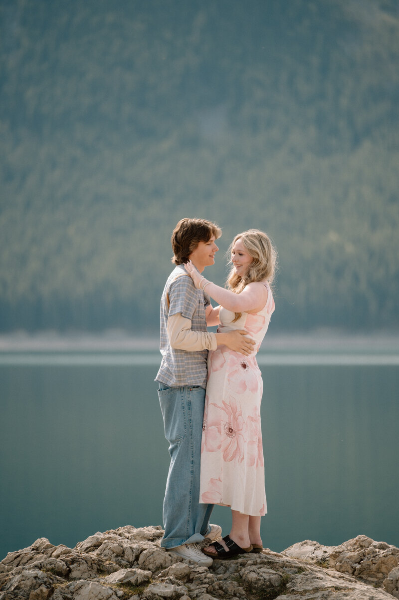 Woman admiring her new engagement ring after being proposed to in Banff National Park at Lake Minnewanka
