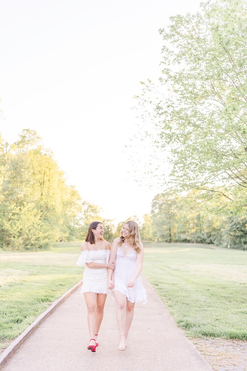 girl best friends walking laughing during Loudoun County, VA senior pictures
