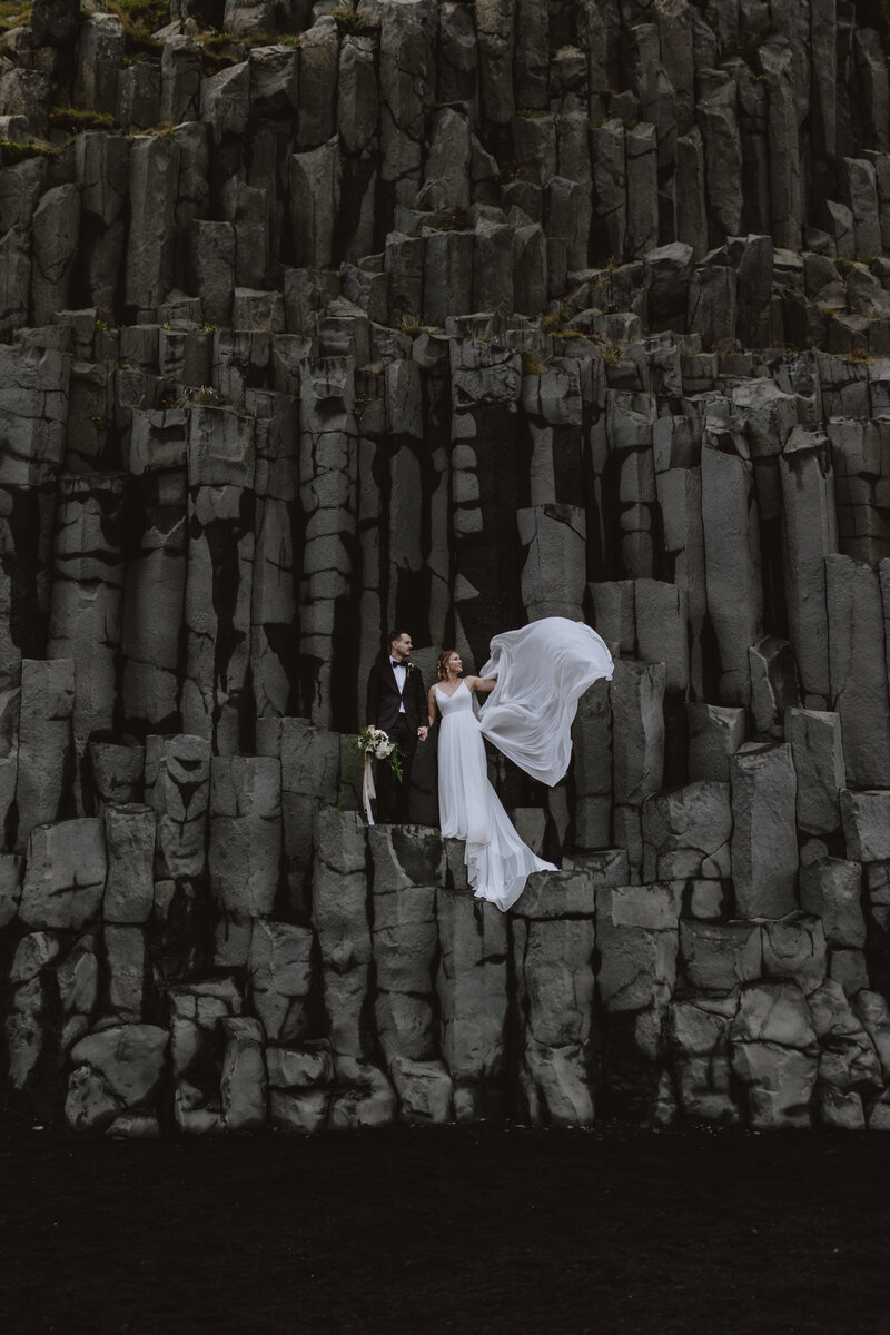 bride and groom on basalt columns