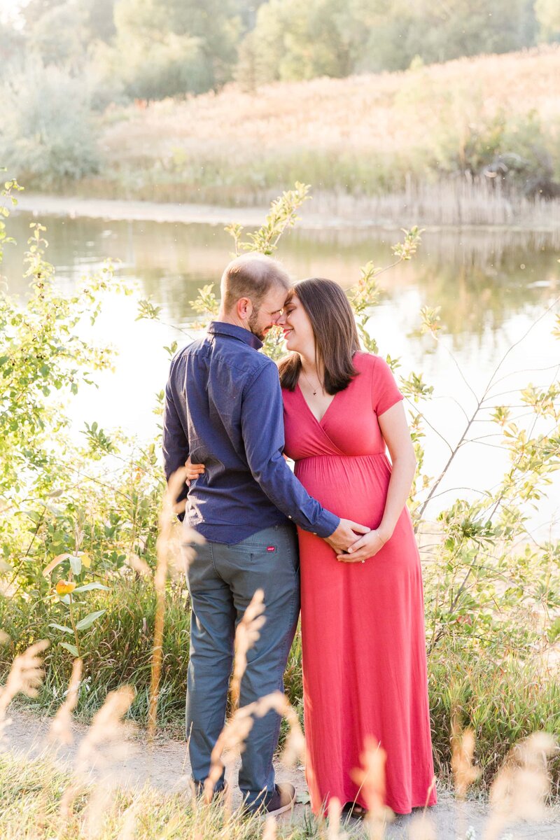 maternity couple touch forehead to forehead in Arvada, CO