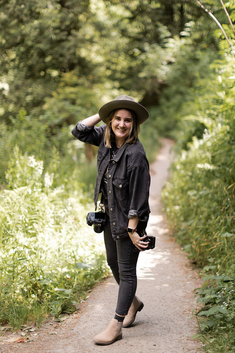 girl in jacket and hat smiling