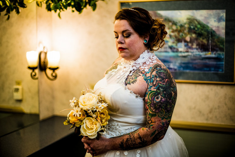 Bride standing with her bouquet at the Erie Yacht Club