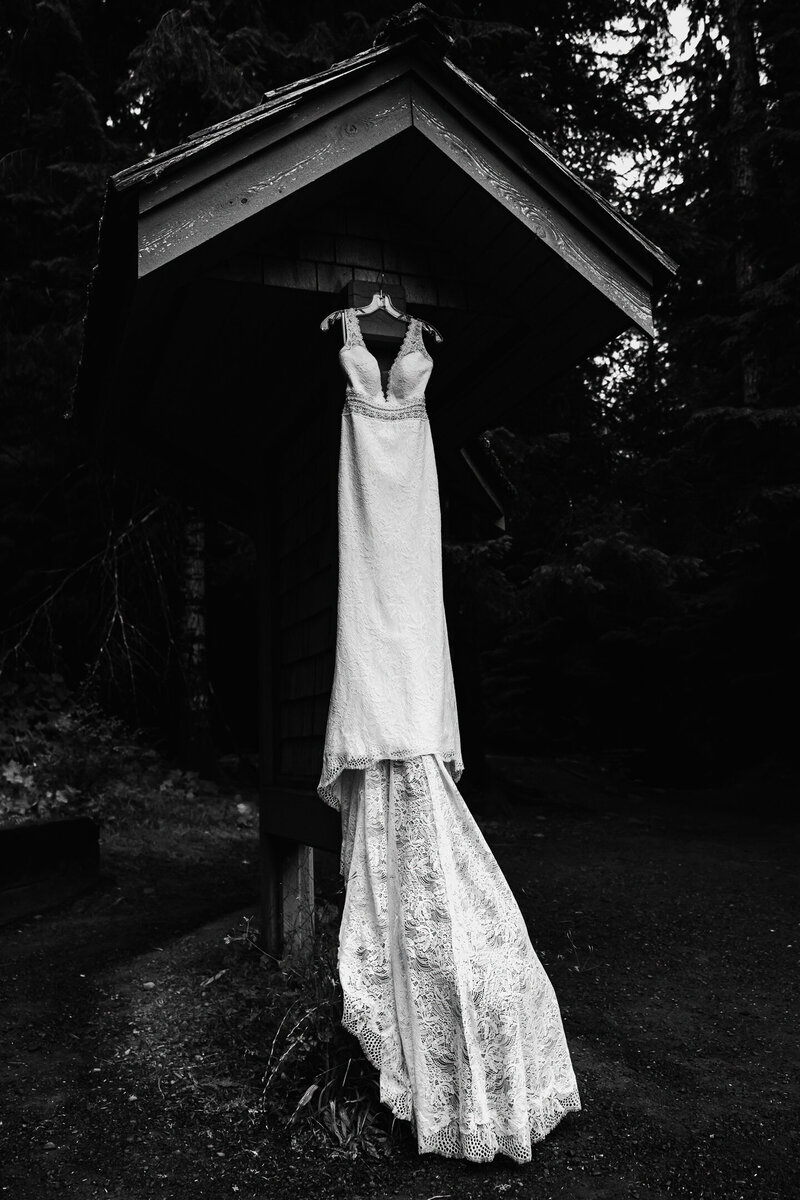 a wedding dress hands near the trail map before being worn