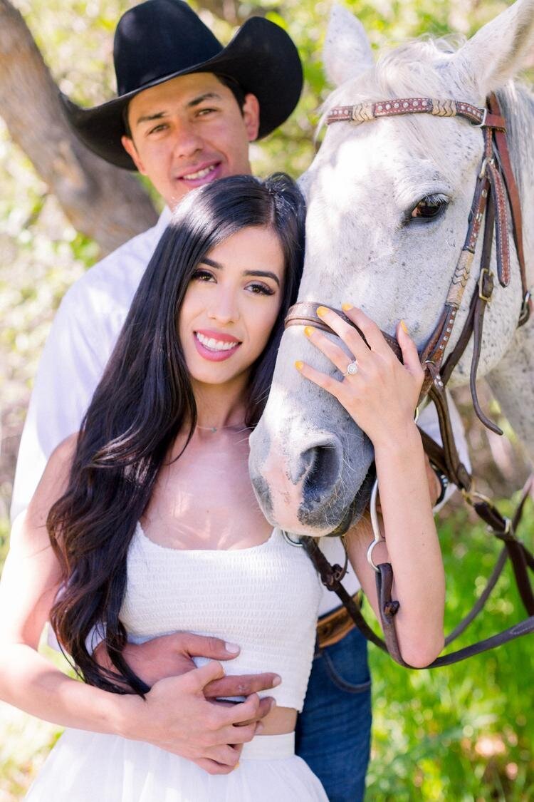 Couple-holding-white-horse-in-Rifle-Colorado.jpg