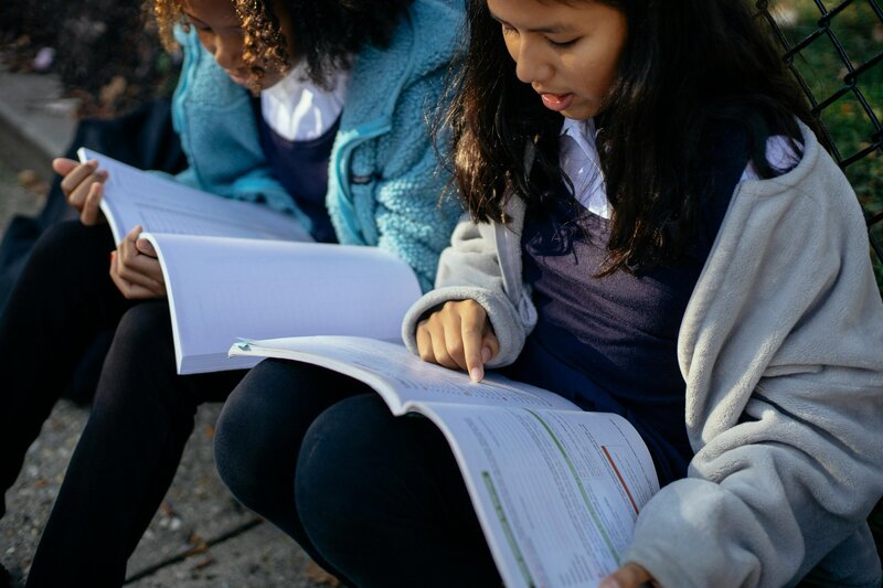 Two students working on homework with each other