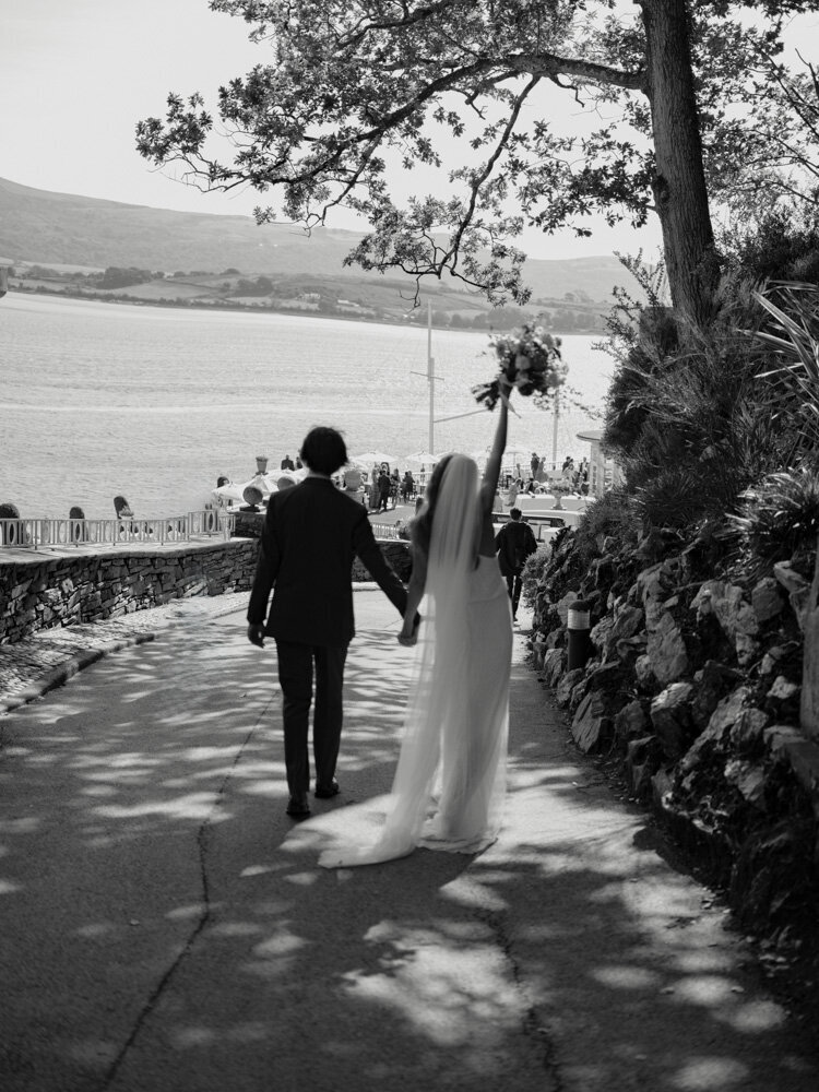 bride and groom walking to reception at portmeirion wales wedding