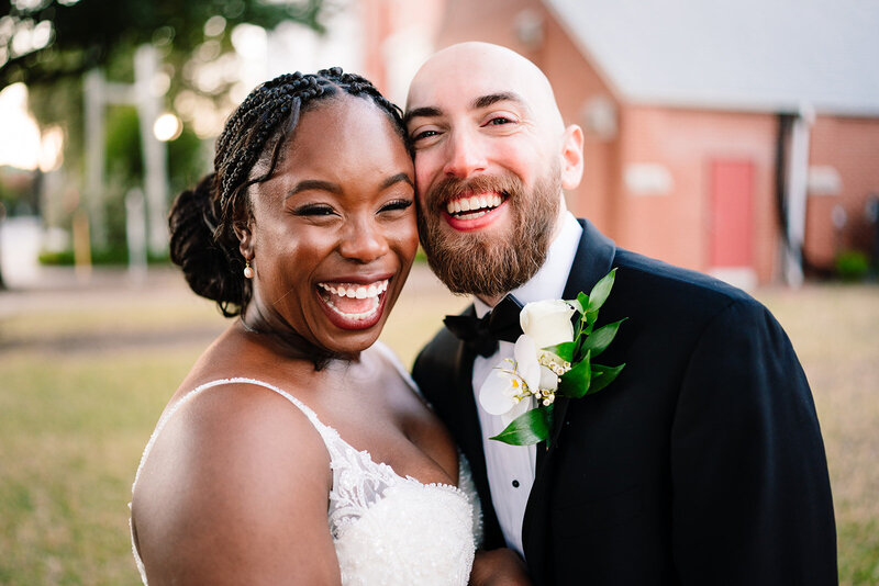 bride and groom standing under chuppah while exchanging vows