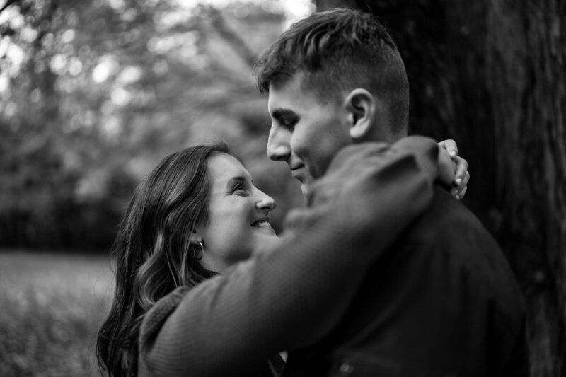 Black and white pennsylvania engagement photos of a couple kissing at McConnell's Mill State Park