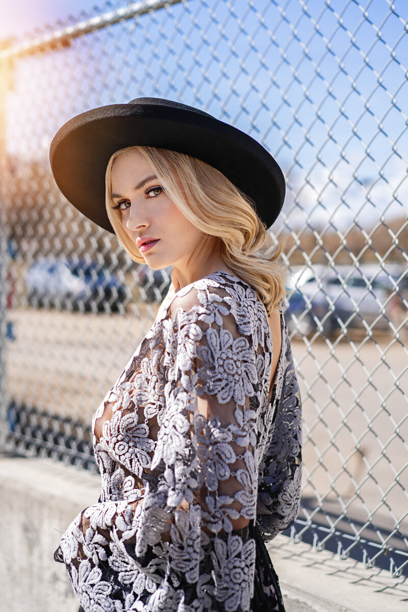 girl wearing lace and cowboy hat