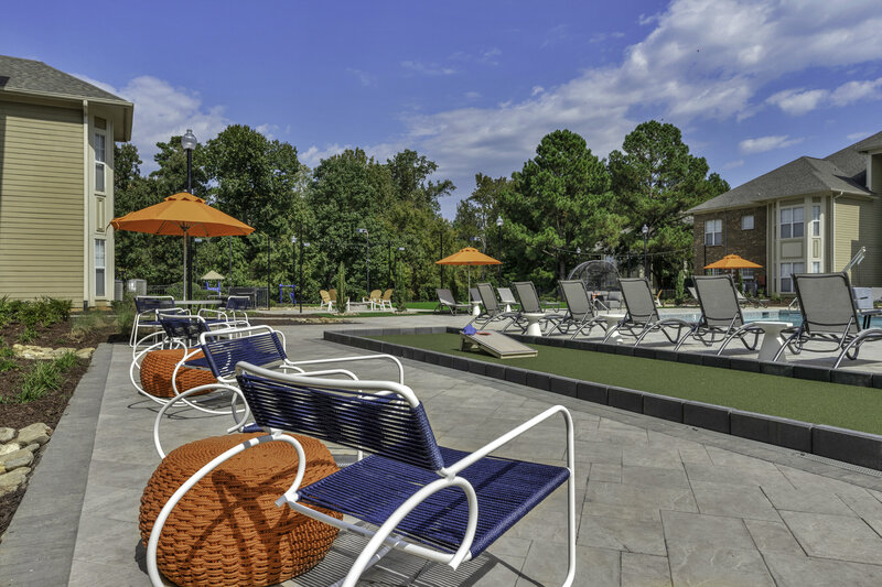 Exterior Design for an apartment complex pool. Commercial interior design and landscape design.  Outdoor seating. Design by Gracious Home Interiors.