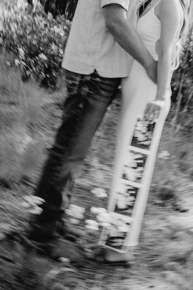 A couple showing their ultrasound to announce their pregnancy