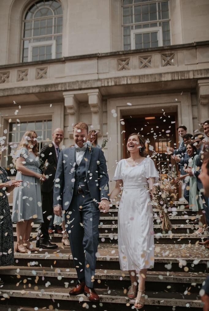 Bride and groom ceremony exit and confetti toss