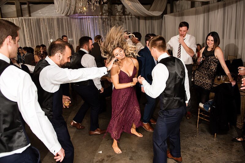 Bridesmaid dancing and flipping her hair in the air