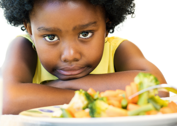 Thrive by Spectrum Pediatrics image for book titled anxious eater, anxious mealtimes practical and compassionate strategies for mealtime peace by Marsha Dunn Klein is a child with food at mealtime