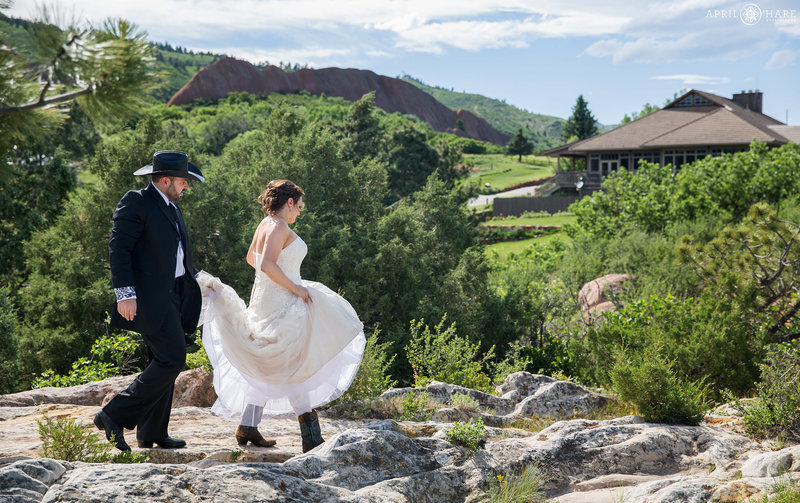 Couple walks to their ceremony after first look at Arrowhead Golf Course