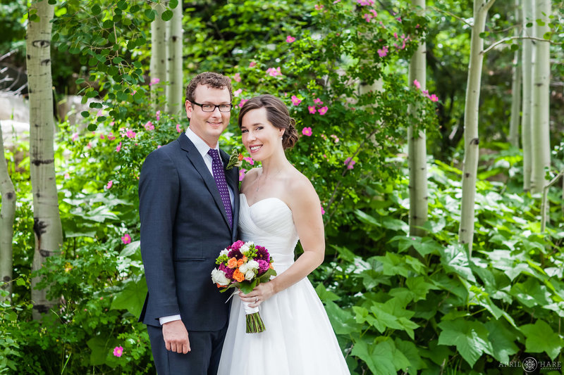 Summer wedding portrait with aspen tree and flowers backdrop at Yampa River Botanic Park