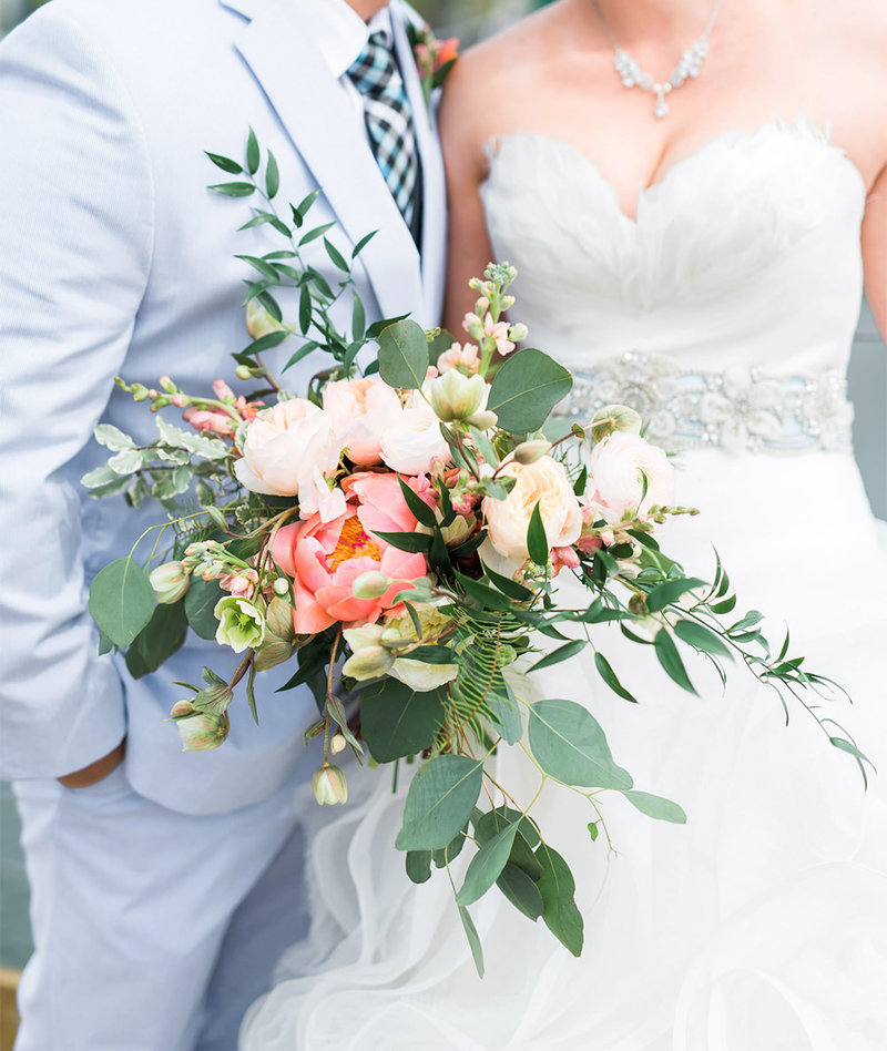 loose bridal bouquet with pink peonies, snapdragons, and eucalyptus leaves