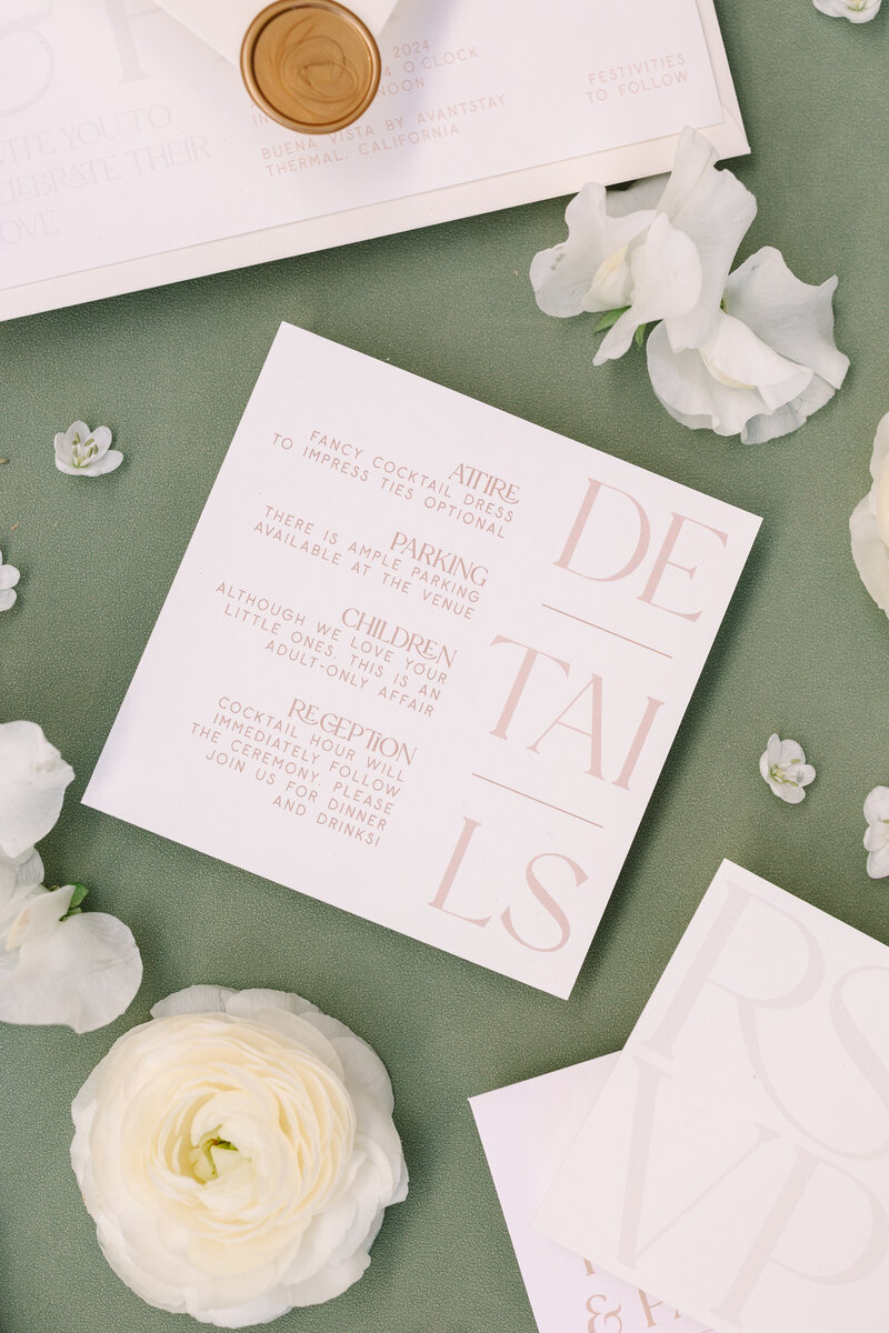 close-up shot of an information page for a wedding with parking, attire, and reception details.