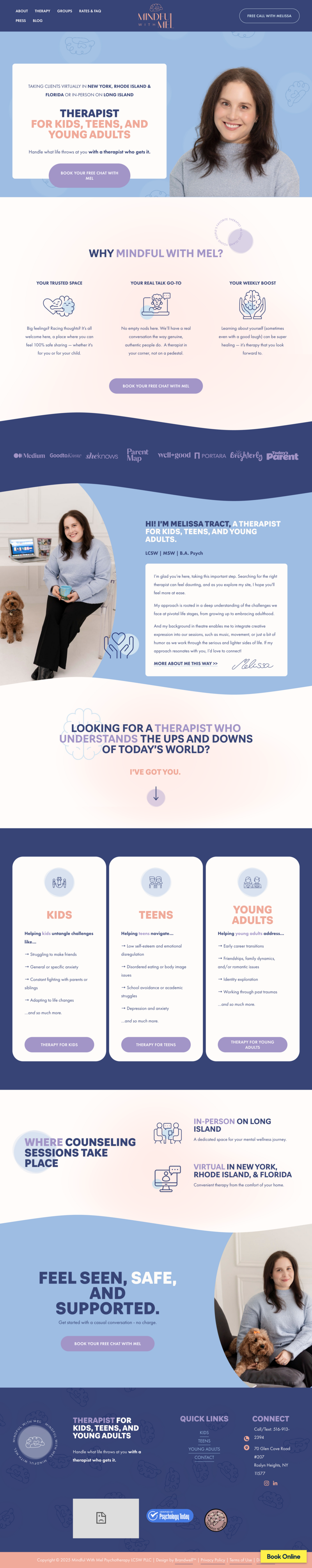 laptop on a table next to a cup of milky coffee