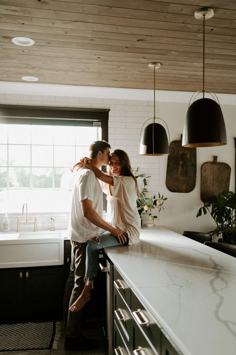 couple embracing in kitchen