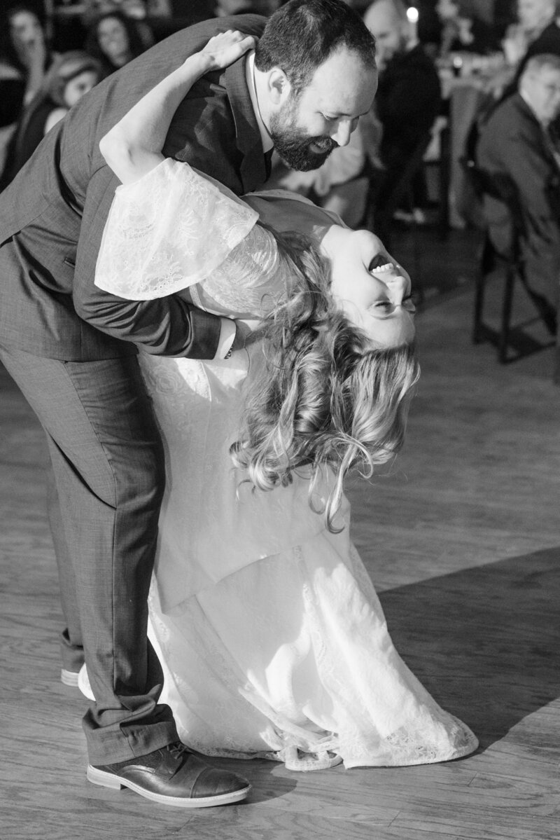 Couple dipping and smiling at the First Dance taken by Austin Wedding Photographer Lydia Teague
