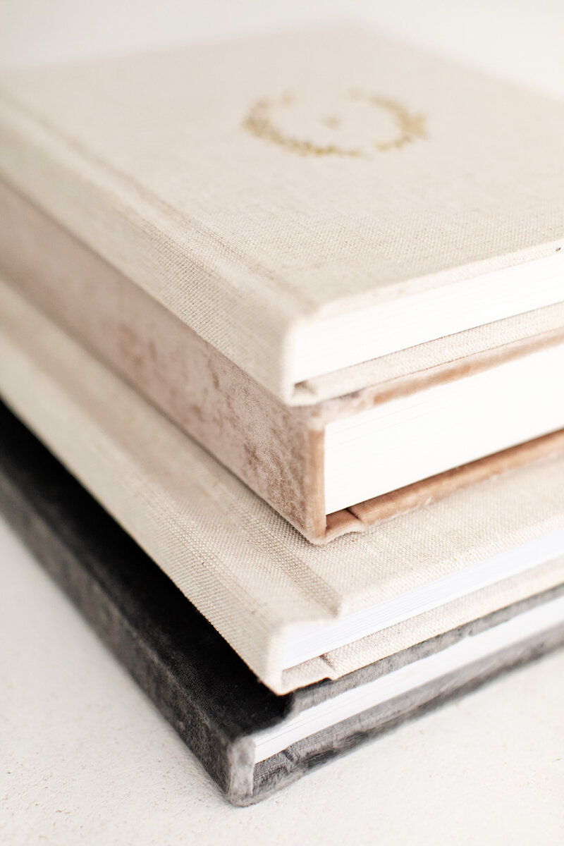 stack of beautiful photo albums in different textures