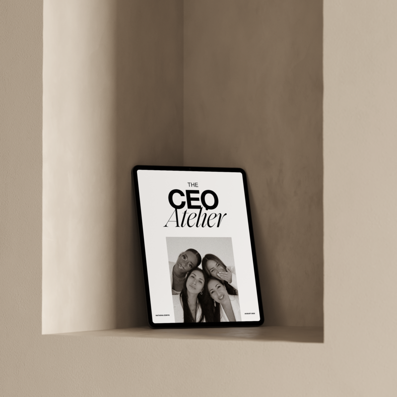 an ipad leaning on a wall with a mockup of business expert natasha zoryk's free online business resource pack The CEO Atelier
