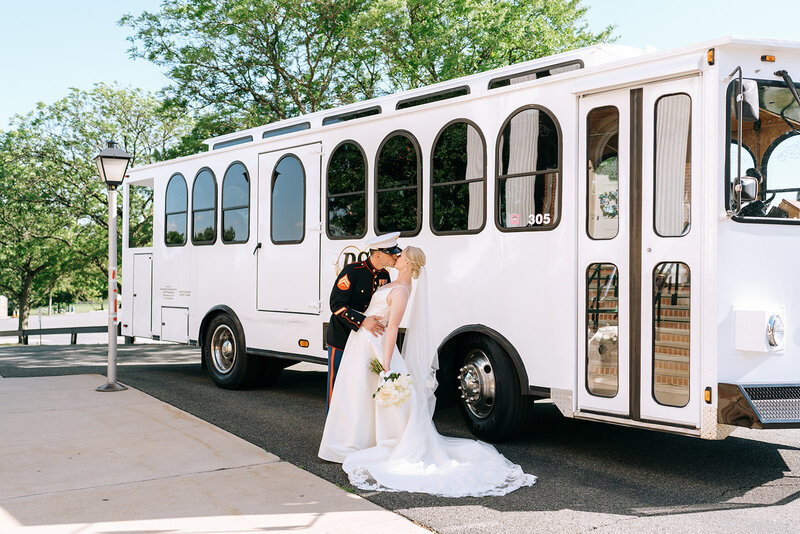 bride and groom kiss by trolley