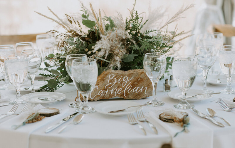 Stone table numbers for a mountain wedding