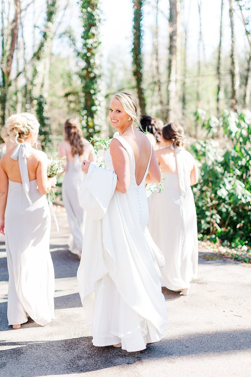 bride walking with bridesmaids by Knoxville Wedding Photographer, Amanda May Photos