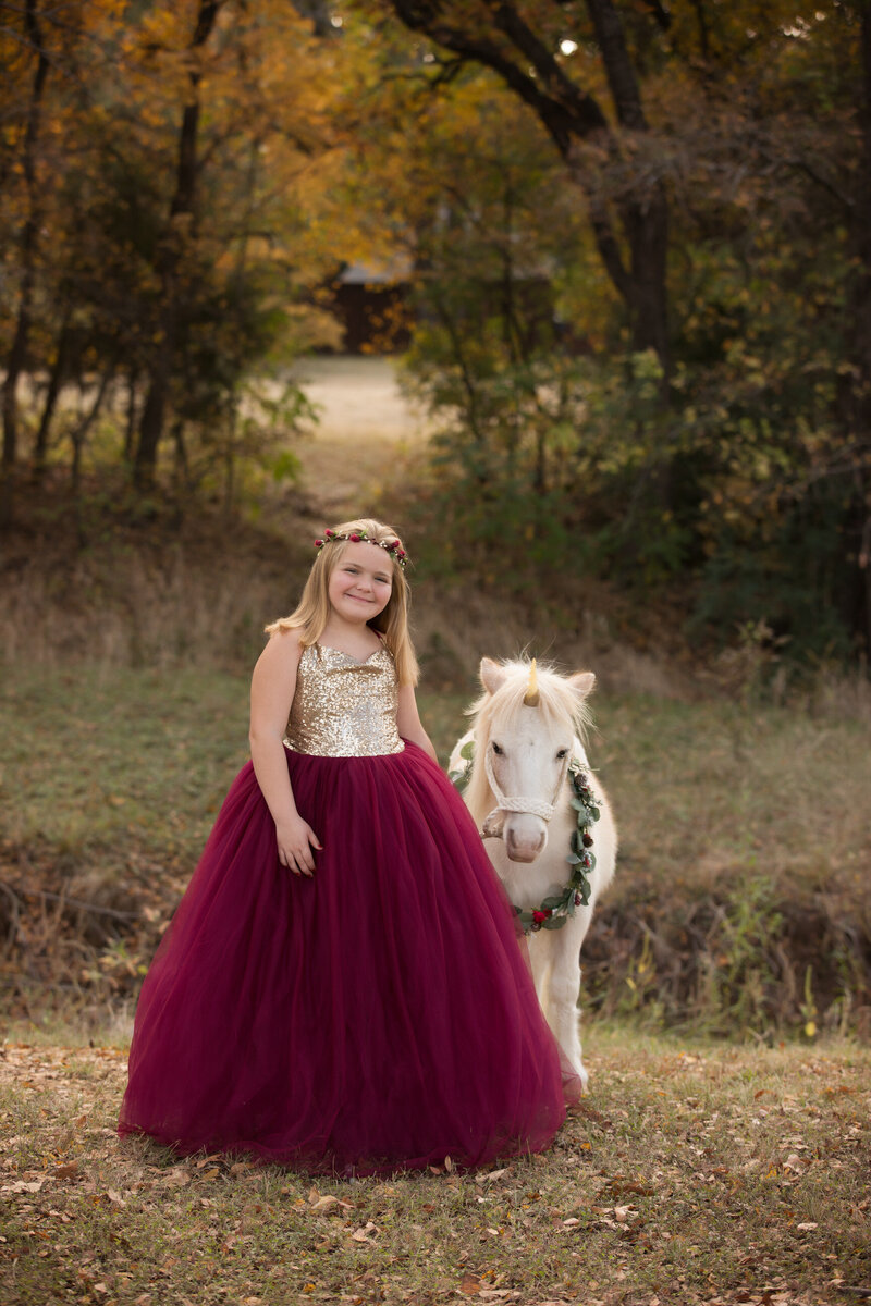 girl-in-red-couture-gown-with-unicorn