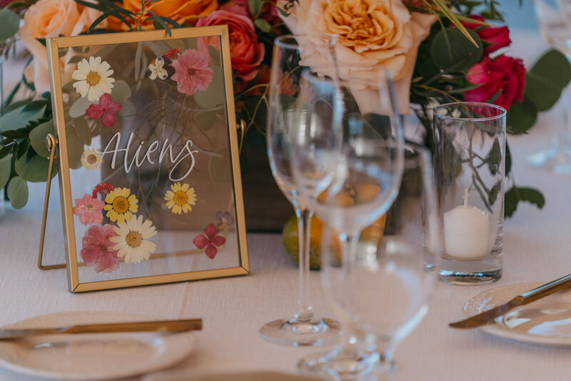 Floral frame table numbers for a colorful summer wedding