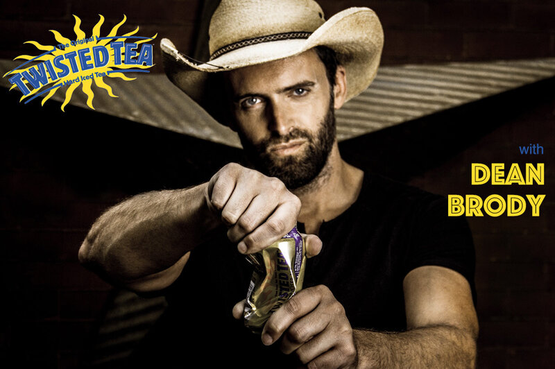 Branding Portrait Dean Brody with cowboy hat twisting Twisted Tea can