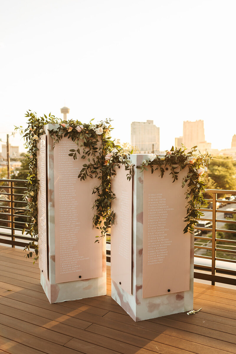personalized standing seating chart at rooftop wedding
