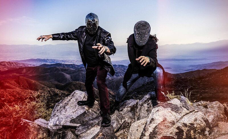 Music Duo photo Casper and Linboy standing on rocks desert valley behind them