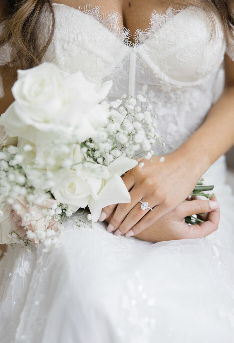 bride with ring and flowers