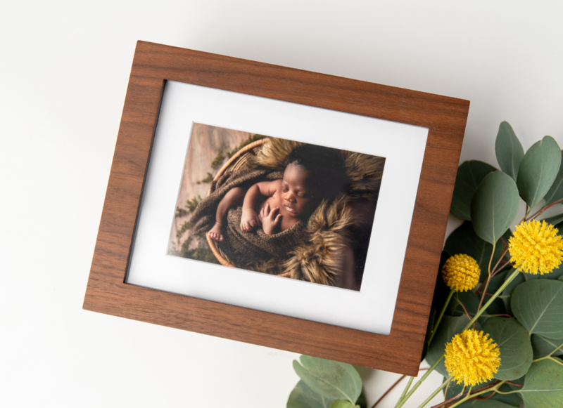 Newborn print matted with a wooden frame