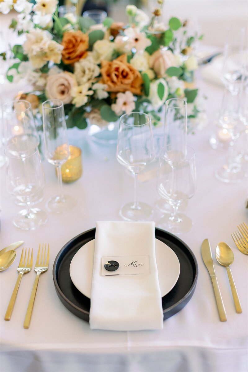 Flowers brighten and excite a wedding table setting.