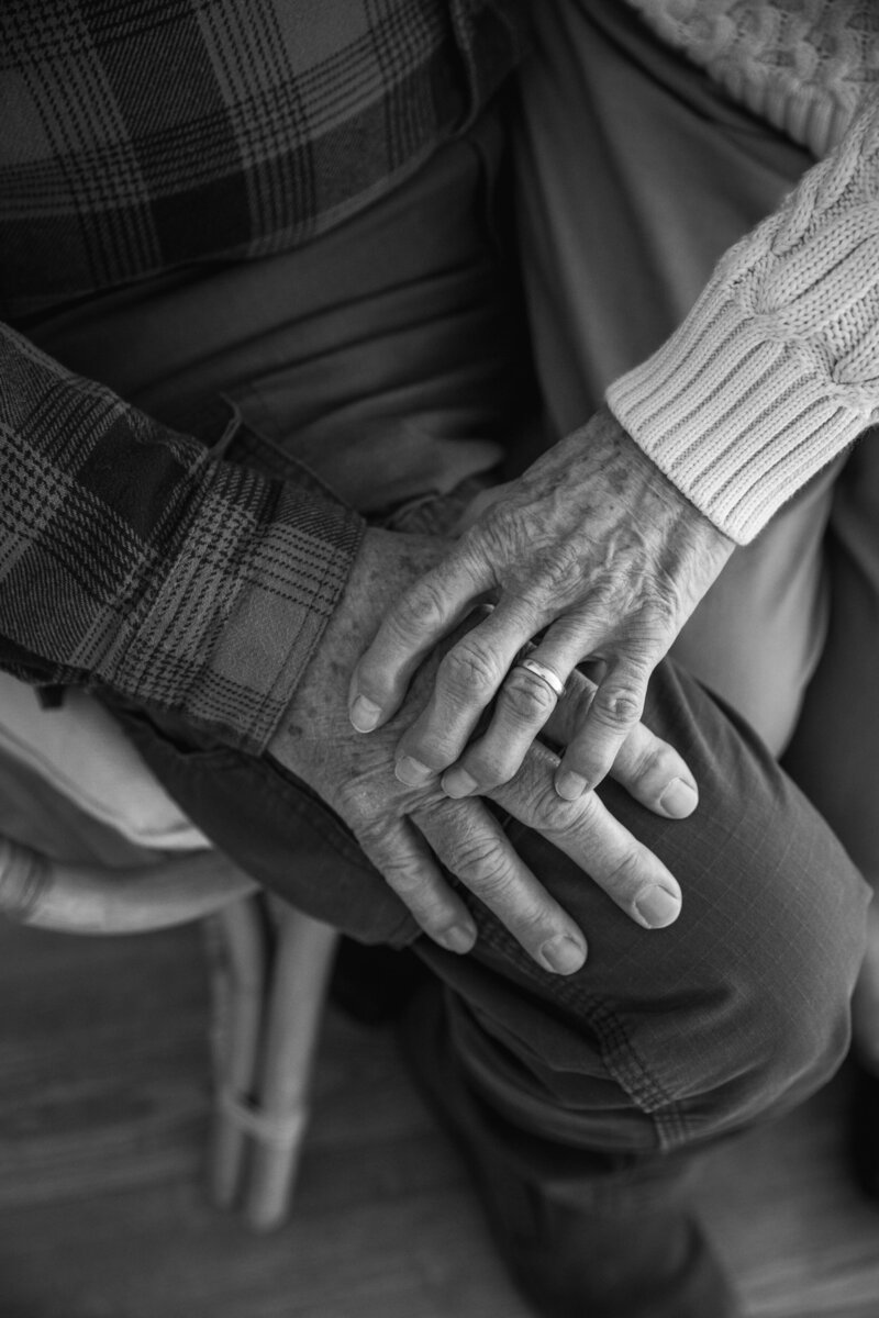 black and white close up of elderly couple's hands