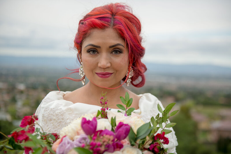 Multi ethnic bride with colorful makeup for. wedding day