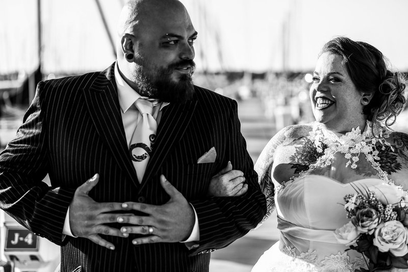 Bride smiles at her groom  at the Erie Yacht Club