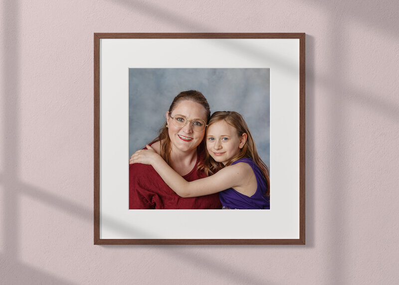 Portrait of a monther and her daughter displayed in a beautiful framed print