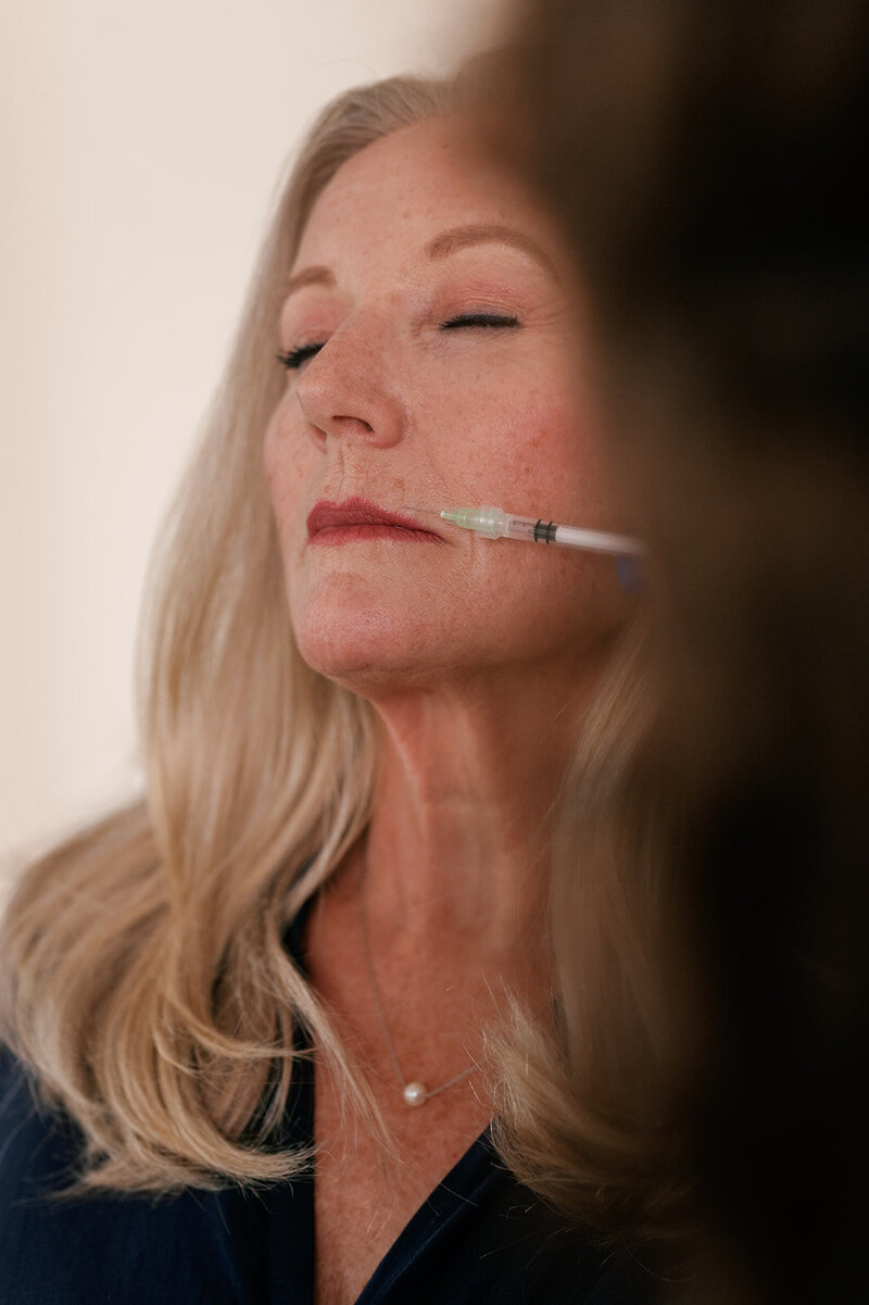 Woman receiving injectable treatment on her face at Zula Modern Medspa