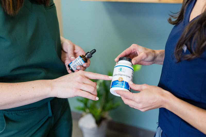 Women holding supplements